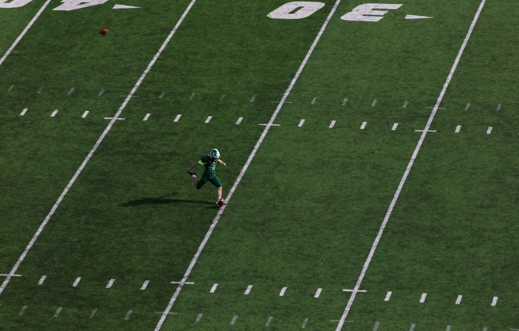 Matthew Kamper warms up during halftime